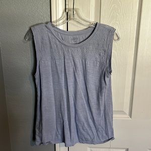 purple/ blue tank top almost a periwinkle color. has some lace detail on top